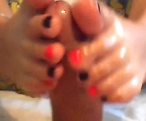 Girl jerking dick with feet
