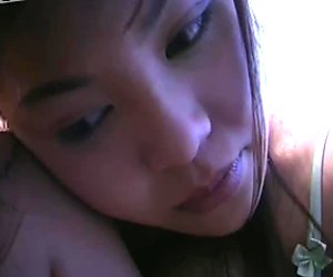 Japanese babe Yoko Matsugane is posing on web cam showing off her big boobs