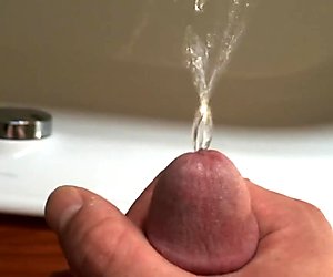 little boy pees in bath with his beautiful penis glans
