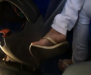 Candid Ebony Foot in bus flip flops