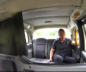 Busty british cabbie cockriding backseat guy