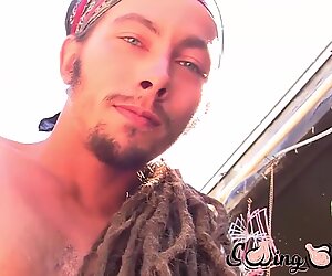 Dreadlocks stud plays with his nuts and dick outdoors
